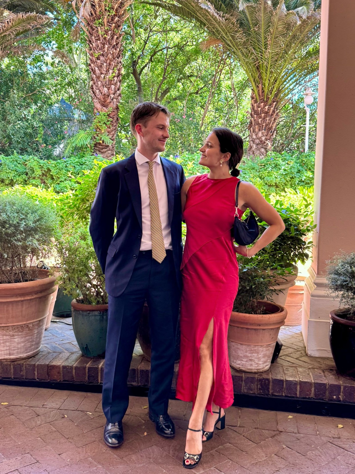 Zoe & Pete dressed up together in a garden