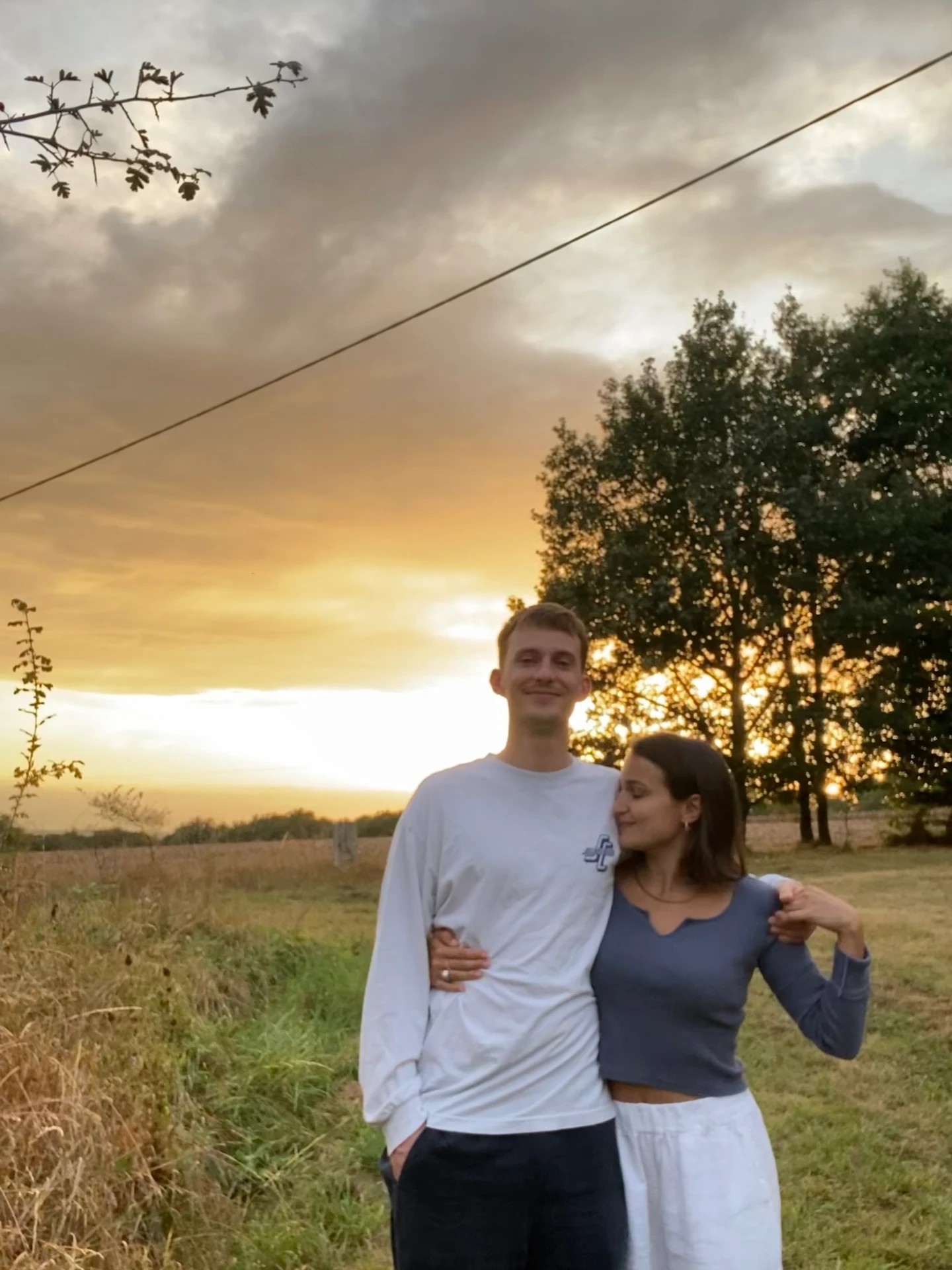 Zoe & Pete walking in the countryside at sunset