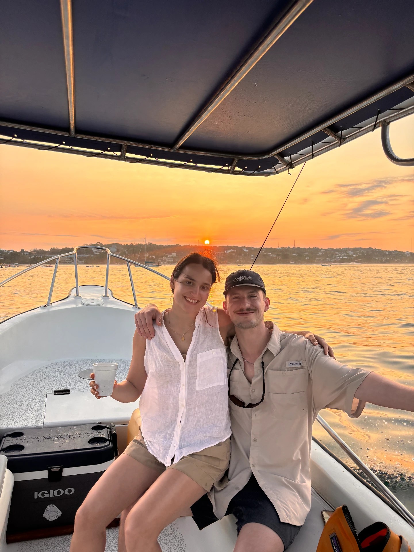 Zoe & Pete together on a boat at sunset