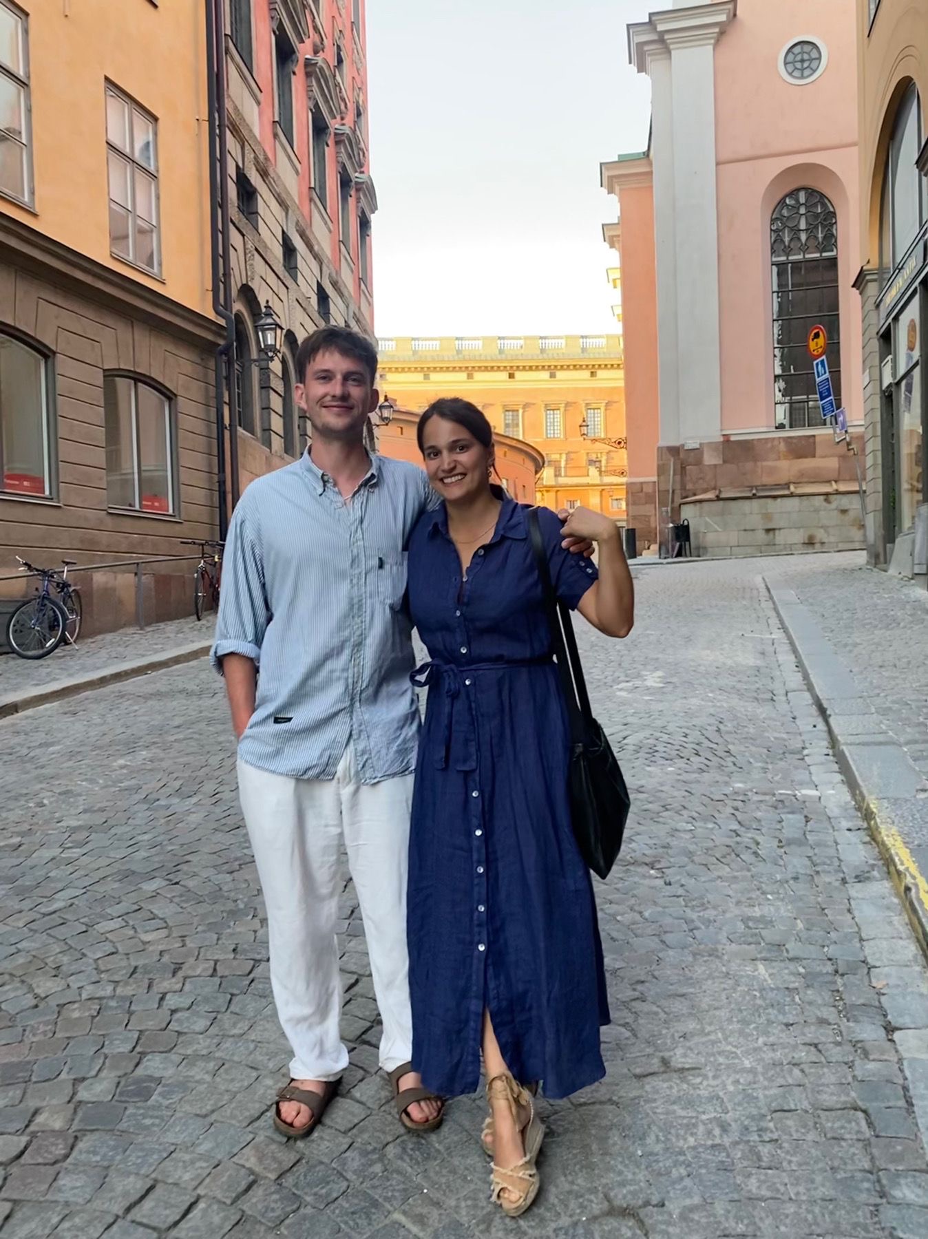 Zoe & Pete on a cobbled street in Stockholm