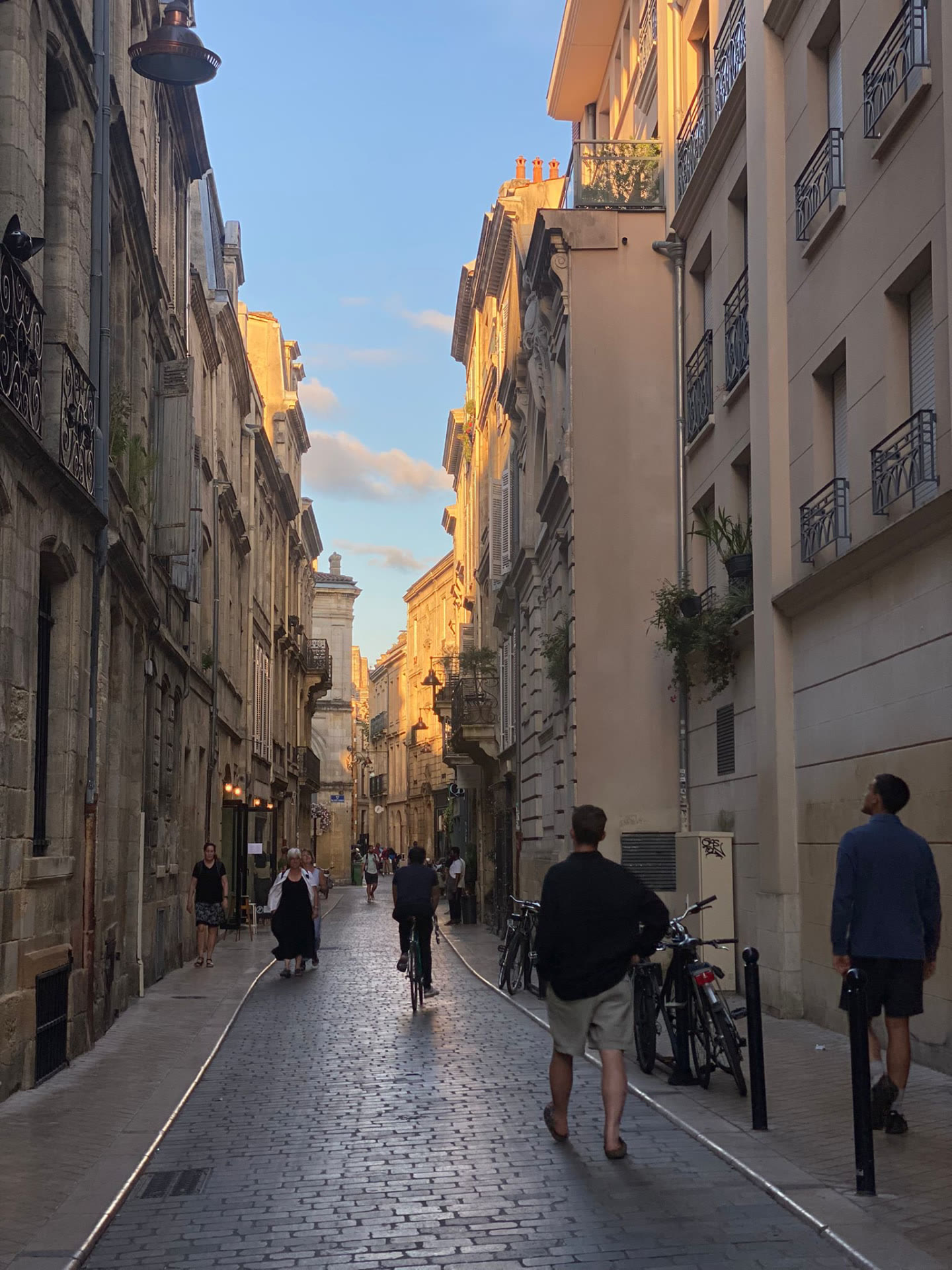 A cobbled street in Bordeaux at golden hour
