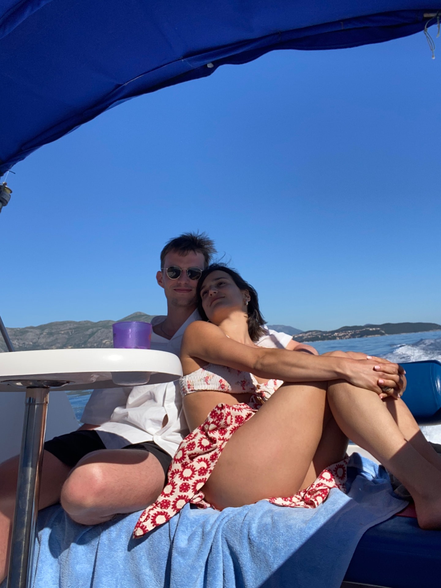 Zoe & Pete relaxing in the sunshine on a boat