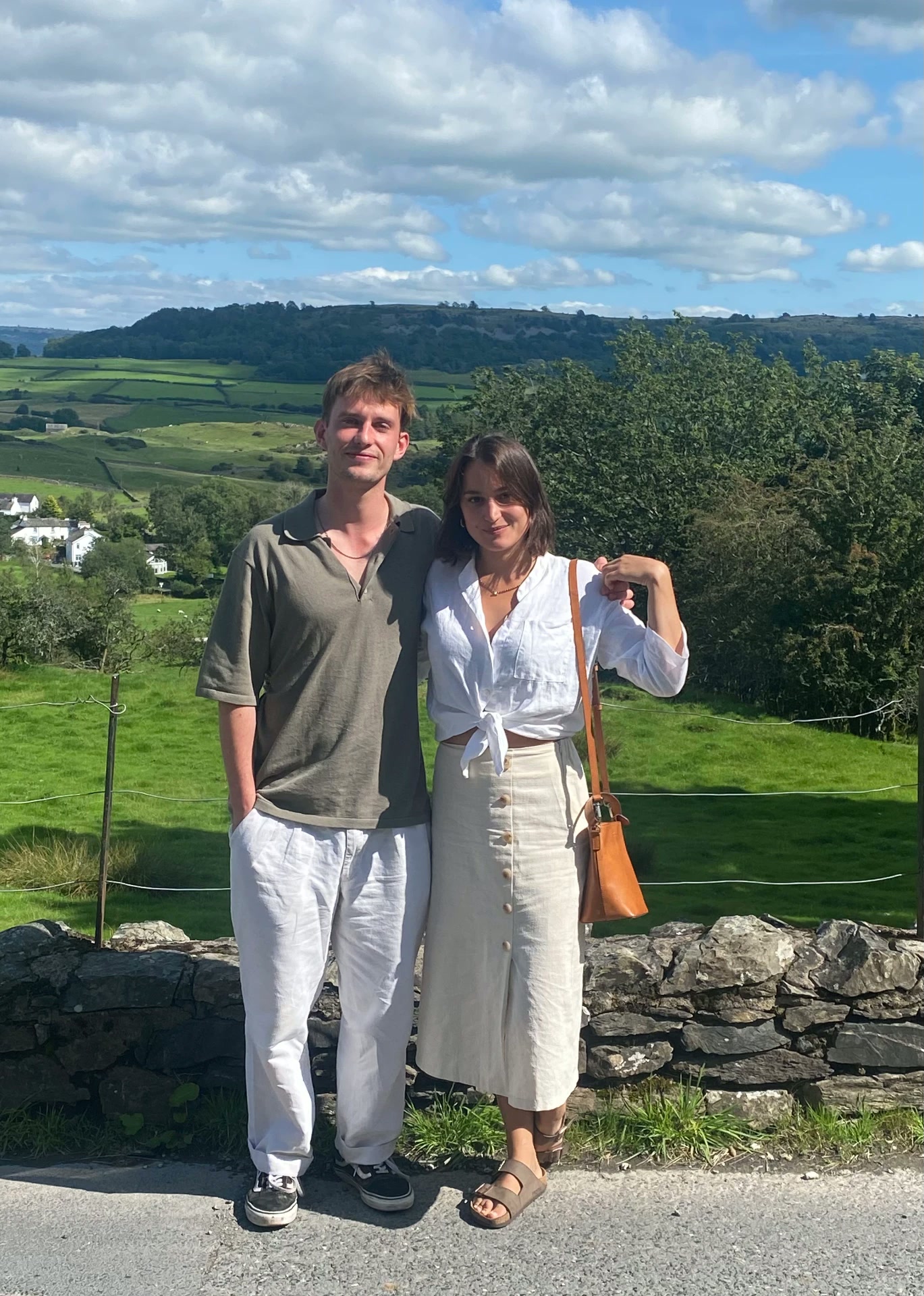 Zoe & Pete standing in the Lake District countryside